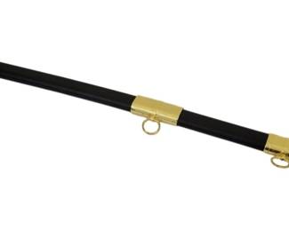 463 - Military Style Sword w/ Sheath CSA Embossed (Description): A decorative military style sword with  matching sheath. The sword features a  gold-tone metal hilt with an eagle motif and  wrapped black grip. The black scabbard is  accented with gold-tone metal fittings including suspension rings for display or  carry. Measures 33.5 inches in overall  length.