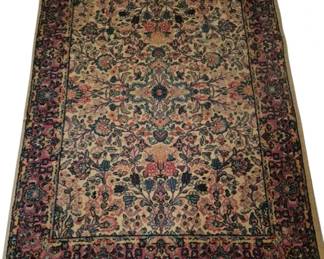 3780 - Karastan Imperial Pattern Rug 72"x52" (Description): Karastan Imperial pattern rug featuring an  ornate floral design with a cream field and  rose-colored border. The rug displays  intricate traditional Persian-inspired motifs  in shades of blue, pink, cream, and navy throughout.