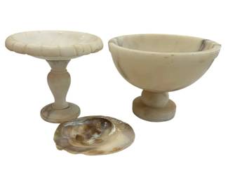 649 - 2 Marble Compotes & Shell 7.5" (Description): Two marble compotes accompanied by a  decorative shell. The compotes feature  classical pedestal designs with varying bowl  shapes. Measures 7.5 inches.
