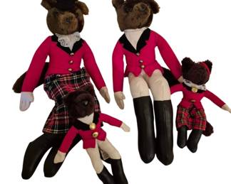 4076 - Lot of Fox Family Bears in Equestrian Attire (Description): A charming lot of four Fox Family Bears  dressed in coordinating equestrian-themed  attire. The plush bears feature brown fur and  are outfitted in matching pink hunting  jackets with black collars and gold-tone buttons. Two bears wear plaid skirts while  two sport tan riding breeches, all paired  with black riding boots. The family includes  two larger adult-sized bears and two smaller  child-sized bears, creating a delightful