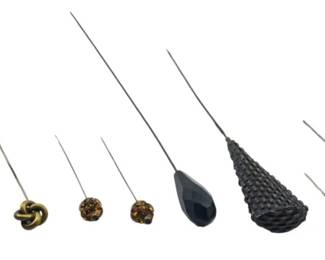 118 - Lot of Assorted Vintage Hatpins (Description): A lot of assorted hairpins featuring various  decorative heads in different styles and  materials. The collection includes pins with  ornate metalwork, beaded designs, and  decorative finials in gold-toned and dark finishes.
