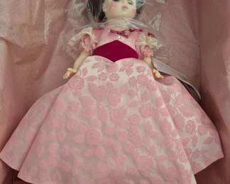 1383 - Madame Alexander Francis Cleveland Doll 13" (Description): The doll features a pink floral dress with  lace accents and comes in original packaging  with tissue paper.