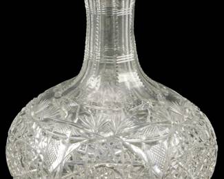 133 - American Brilliant Cut Glass Water Bottle (Description): American Brilliant cut glass water bottle  featuring intricate cut patterns. Measures  7.5 inches.