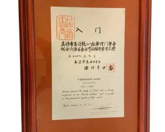 1176 - Japanese Ikebana Certificate to Ruth Toone (Description): Japanese certificate issued to Ruth Toone.  The framed certificate features both Japanese  characters and English text, with a  prominent red seal. Measures 23.5 inches by  17.5 inches.