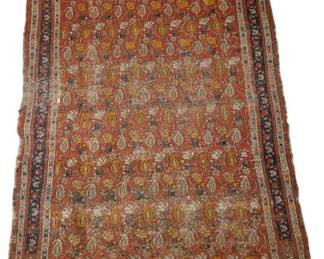3915 - Persian Hand Knotted Rug w/ Wear 52 x 40 (Description): Antique Persian style wool rug featuring an  all-over boteh (paisley) pattern on a coral  red ground. The field displays repeating rows  of traditional boteh motifs in cream, gold,  and navy blue tones. Multiple decorative borders frame the central design, with  geometric and floral patterns in coordinating  colors. The rug features knotted fringe on  two ends. Shows age-appropriate wear  consistent with its antique status. Measures
