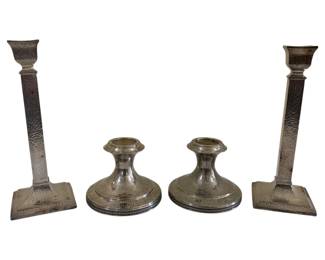 1670 - 2 Sets of Candlesticks Tallest Hand Hammered (Description): The tallest pair features a hand hammered  finish with square bases and columnar stems.  The shorter pair has a smooth rounded design  with circular bases. Tallest measures 10  inches.