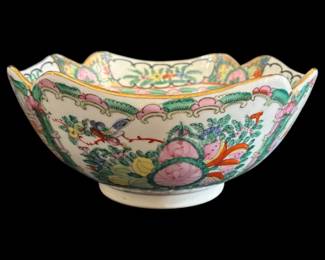 538 - Chinese Rose Medallion Bowl 9.5"x4.5" (Description): Rose Medallion bowl featuring traditional  Chinese export porcelain decoration. The  interior displays alternating panels of  figural court scenes and floral motifs with  pink peonies and green foliage, centered around a medallion with a figure. The  scalloped rim is decorated with floral  cartouches on a white ground with gilt trim.  Measures 9.5" x 4.5".