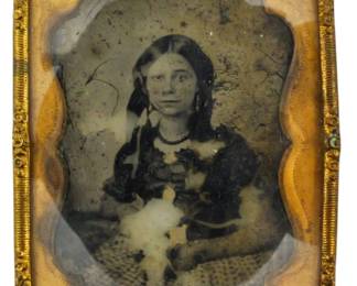 195 - Ninth Plate Daguerreotype of Woman 2.5"x2" (Description): A ninth plate daguerreotype portrait of a  woman. The image is housed in an ornate brass  frame with decorative scrollwork edges.  Measures 2 1/2 inches by 2 inches.