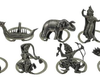 105 - 11 Siam Sterling Charms 1.24oz (Description): Collection of eleven Siam sterling silver  charms featuring traditional Thai motifs  including temples, boats, elephants, and  figures in various poses. Total weight  1.24oz.