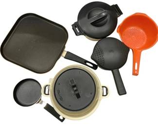 927 - Assorted Cookware Lot Pots Pans Strainers (Description): A collection of assorted cookware including a  square non-stick griddle pan, lidded pots in  cream and black colorways, a small saucepan,  and strainers in black and orange. The lot  features various kitchen essentials suitable for everyday cooking needs.
