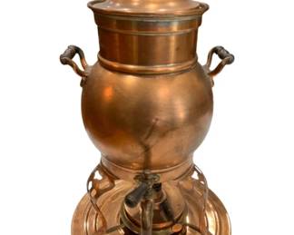 650 - Vtg Copper Coffee Pot Urn w/ Warmer Stand 15" (Description): Vintage copper coffee pot measuring 15 inches  tall. This handsome urn-style piece features  dual handles and a dispensing spigot,  resting on a warming stand with a circular  base.