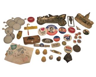2734 - Group Political Buttons, Souvenirs (Description): A diverse collection of political buttons,  souvenirs, and collectibles. The assortment  includes presidential campaign buttons  featuring Nixon Agnew and President Ford,  along with various congressional campaign buttons including Goode for Congress. Also  included are Lions Club pins, vintage  coasters, a metal Capitol building souvenir,  a cast metal race car, assorted stamps,  thimbles, a leather key holder with vintage