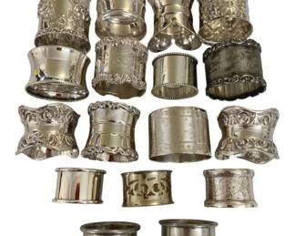 423 - 17 Silver Plate Napkin Holders (Description): Assorted decorative styles.