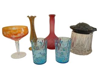 405 - Group Lot of Art Glass w/ Art Nouveau Jar Lid (Description): Group lot of art glass featuring an  assortment of decorative pieces including an  amber cut-to-clear compote with etched floral  design, a small amber bud vase, a pink satin  glass bottle vase, a pair of blue opalescent tumblers with hand-painted floral  decoration, and a cut glass biscuit jar with  Art Nouveau style silver plate lid. Jar lid  as is.