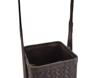 442 - Andrea by Sadek Bronzed Basket 13" (Description): Bronzed basket featuring a decorative woven  basketweave pattern throughout the body. The  square-form vessel has a tall arched handle  attached at opposite sides. The piece has a  dark patinated finish. Measures 13 inches tall.