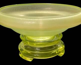 2774 - Vaseline Stretch Glass Bowl on Stand Uranium (Description): Vaseline glass stretch bowl with stand  featuring uranium content. The piece measures  4.5 inches in height by 9 inches in  diameter.
