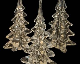 2788 - 3 Silvestri Crystal Christmas Trees 8.5" (Description): Three Silvestri crystal Christmas trees.  These elegant clear crystal figurines feature  a tiered, sculptural design capturing the  classic silhouette of evergreen trees with  pointed tops and star-shaped bases. Each tree measures 8.5 inches tall.