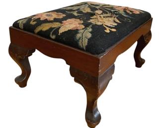 1352 - Needlepoint Foot Stool 10"x12"x16", as is (Description): Needlepoint stool with tear in top. The stool  features a floral needlepoint top on a  wooden frame with cabriole legs.