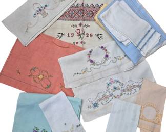 1430 - Vtg Embroidered Linen Towels & Cloths Lot (Description): Collection of vintage embroidered linen  towels, cloths, and textile pieces. The  assortment includes various hand towels and  decorative linens featuring colorful  embroidered designs including floral motifs, cross-stitch patterns, and decorative  borders. One piece is dated 1929 with an  ornate monogram. Colors include white, cream,  coral pink, light blue, and aqua, with  embroidery in various hues. Several pieces