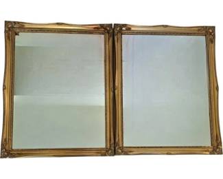 3711 - Pr Gilt Framed Beveled Wall Mirrors 29"x23" (Description): Pair of elegant wall mirrors featuring ornate  gilt frames with scrolled corner accents and  decorative carved details. The frames  display a warm gold finish with classical  styling. Each mirror measures 29 inches by 23 inches.