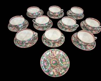 498 - Rose Medallion Porcelain Cups & Saucers (Description): A collection of Rose Medallion porcelain  consisting of 12 saucers measuring 5 inches  in diameter and 11 cups. The pieces feature  the traditional Rose Medallion pattern with  figural and floral panels in characteristic pink, green, and gilt decoration