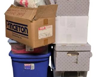 4114 - Group Lot of Sewing Items in 12 Containers (Description): Group lot of sewing items contained in 12  assorted containers. The collection includes  materials stored in a variety of storage  solutions including blue plastic bins, clear  plastic totes, decorative fabric-covered boxes, and cardboard boxes. An excellent lot  for the avid sewer or crafter.