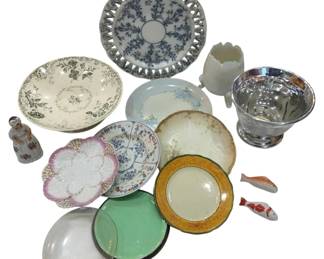1219 - Assorted Decorative Plates & Tableware (Description): A collection of assorted decorative plates  and tableware pieces. The grouping includes  various ceramic and porcelain plates in  different patterns and styles, including a  blue and white reticulated plate, a green transferware plate, a floral hand-painted  plate, and several other decorative dishes.  The lot also features a silver-toned compote  bowl, a milk glass vase with ruffled edge, a  small porcelain figurine, and decorative fish