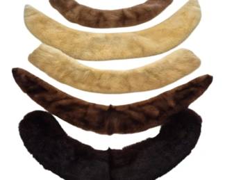 1300 - Five Vintage Fur Collars in Assorted Colors (Description): Collection of five vintage fur collars in  assorted colors including blonde, brown,  mahogany, and dark chocolate tones. The  collars feature curved silhouettes designed  to attach to coats or jackets, displaying the plush, soft texture characteristic of  quality fur garments from the mid-20th  century.