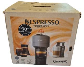 2830 - Nespresso Vertuo Next & Aeroccino3 in Box (Description): Nespresso Vertuo Next coffee machine with  Aeroccino3 milk frother, made by DeLonghi.  The unit comes in its original retail box. Used as is electric/electronic/mechanical  item. No guarantee all components, untested.
