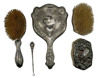 746 - Assorted Unmarked Metal Beauty Items (Description): A collection of assorted unmarked metal  beauty items including brushes and vanity  accessories. The pieces feature decorative  metalwork in various styles.