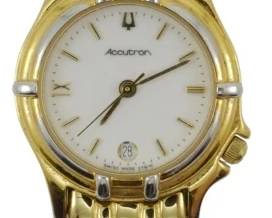 1902 - Bulova Accutron Ladies Gold Tone Watch (Description): Bulova Accutron ladies gold tone watch  featuring a stainless steel construction.  Please note this watch has no movement. Used as is electric/electronic/mechanical  item. No guarantee all components, untested.