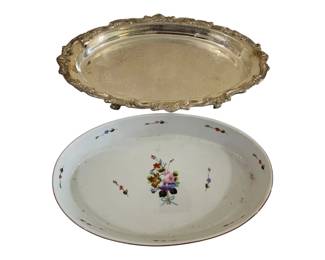 581 - Oval Casserole Dish in Silver Plate Tray (Description): Oval casserole dish with decorative footed  stand. The porcelain insert features floral  decoration with a red trim border. Measures  3.5 inches high by 21 inches long by 13  inches wide.