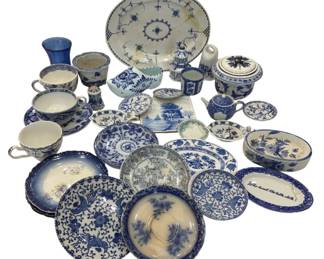 990 - Assorted Blue & White Porcelain Collection (Description): A collection of assorted blue and white  porcelain and ceramic pieces. The grouping  includes various plates, bowls, cups,  saucers, a covered jar, a vase, tiles, and  serving pieces in traditional blue and white patterns including Delft-style, chinoiserie,  and floral designs. Pieces appear to span  various origins and periods, featuring  hand-painted and transfer-printed decorations  typical of Dutch, English, and Asian