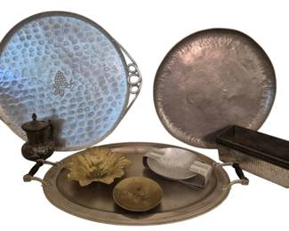 3982 - Group Lot of Assorted Metal Trays & Dishes (Description): A group lot of assorted metal items including  two hammered aluminum trays with decorative  handles, one featuring an etched grape motif,  a large oval serving tray with handles, a  brass flower-shaped dish, a small brass bowl, a rectangular planter box with textured  sides, and a small silver-plated lidded  container with foliate decoration. Also  includes an aluminum ashtray. Various sizes  and finishes.