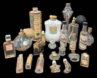 1466 - Assorted Vintage Perfume & Cologne Bottles (Description): A collection of assorted vintage perfume and  cologne bottles in various sizes and styles.  The grouping includes atomizers with mesh and  fabric bulbs, decorative glass stoppers, and  bottles with original paper labels including Essence Imperiale Russe, Flowertime, and  Hoyt's Cologne. Materials include clear  glass, frosted glass, and milk glass, with  various metal and bakelite caps. Some bottles  retain partial contents.