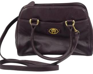 1851 - Vintage Aigner Leather Purse 7"x10"x4" (Description): Vintage Aigner leather purse featuring  gold-tone hardware and the signature Aigner  logo clasp. The bag includes both short carry  handles and a longer detachable shoulder  strap for versatile wear. Measures 7 inches high by 10 inches wide by 4 inchesdeep.