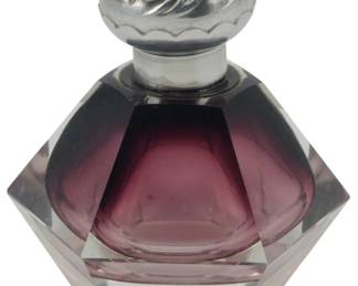 863 - Vintage Amethyst Perfume Bottle (Description): Vintage perfume bottle featuring a decorative  metal cap and faceted glass body.