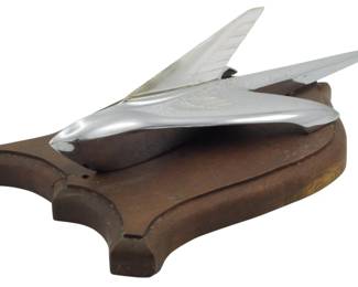 1885 - Vintage Ford Victoria Hood Ornament (Description): Vintage Ford Victoria hood ornament. This  chrome automotive ornament features the  classic streamlined design associated with  the Ford Victoria. Measures 4.5 inches by 12  inches by 8 inches.