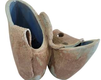 449 - Hand Made Modernist MCM Pottery Vase 7.5"x9.5 (Description): Pottery vase featuring an unusual sculptural  form with intersecting tilted bowl shapes.  The exterior displays a textured,  burlap-impressed surface with an earthy  terracotta tone, while the interior is finished in a contrasting glossy blue glaze.  This distinctive piece showcases modernist  design elements characteristic of the Art  Deco period. Measures 7.5" x 9.5".