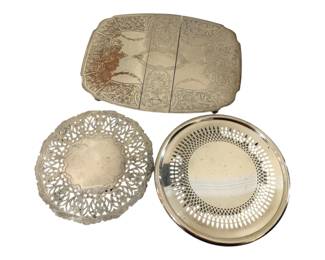 392 - 3 Silver Plate Trivets 7"x10.5" (Description): Featuring various decorative designs  including pierced and engraved patterns.  Measures 7" x 10.5".