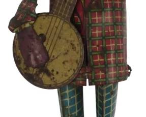 898 - Vintage 1920s Jazebo Jim Tin Jointed Figure 7" (Description): Vintage 1920s Jazebo Jim figure. This  lithographed tin toy depicts a figure playing  a banjo, featuring colorful plaid pattern  clothing. Measures 7 inches.