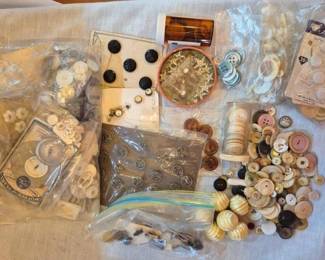 1461 - Assorted Vintage Buttons Collection (Description): A large assortment of vintage buttons in  various sizes, colors, and materials. The  collection includes mother of pearl buttons,  black and white buttons on original cards,  decorative beaded buttons, and loose buttons in cream, brown, pink, and neutral tones.  Some buttons remain on their original retail  cards including Jewel-Tone brand packaging.  The lot also includes specialty buttons with  carved and textured designs, sewing notions,