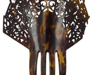 1725 - Vintage Tortoise Shell Haircomb 8"x6" (Description): Vintage tortoise shell haircomb featuring an  ornate pierced design with scrollwork and  fleur-de-lis motifs. The comb has four prongs  and measures 8 inches by 6 inches.