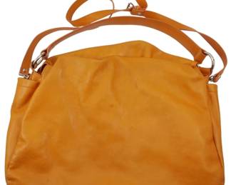 1857 - Doncaster Leather Tote Bag w/ Storage Bag (Description): Vintage Doncaster leather tote bag  accompanied by its original storage bag. The  tote features a soft leather construction  with silver-tone hardware and an adjustable  shoulder strap. Measures 12 inches by 15 inches by 4 inches.