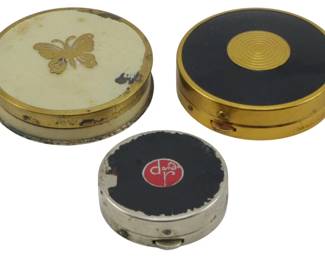 1754 - 3 Assorted Miniature Compacts (Description): A collection of three assorted miniature  compacts. The group includes varied designs  suitable for powder or small cosmetic items.