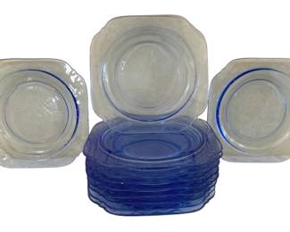 390 - 11 Indiana Blue Madrid Plates 8"x8" (Description): A set of eleven depression glass plates in  the Madrid pattern. Each plate measures 8  inches by 8 inches and features a square  shape with rounded, scalloped corners.
