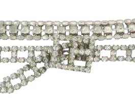 1921 - Vintage Rhinestone Belt (Description): Vintage rhinestone belt featuring a  decorative bow-style clasp and multi-row  rhinestone band construction.