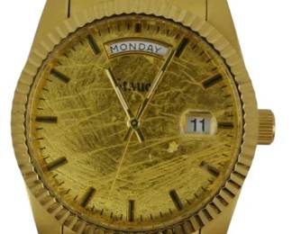 1933 - Stauer Watch w/ Gold Foil Dial (Description): Stauer watch featuring a gold foil dial. The  timepiece includes day and date display  functions with a gold-tone case and bracelet. Used as is electric/electronic/mechanical  item. No guarantee all components, untested.