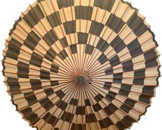 1320 - Vintage Oriental Umbrella 41" (Description): Oriental umbrella featuring a distinctive  bamboo construction with alternating natural  and dark stained strips creating a geometric  pattern. The parasol showcases contrasting  light and dark bamboo panels in a checkerboard-style design. The handle is  crafted from smooth polished bamboo with a  warm honey tone. Measures 41 inches in  length.