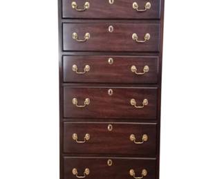 2048 - Henkel Harris Lingerie Chest 53"x22"x16" (Description): Henkel Harris lingerie chest in rich mahogany  finish featuring nine drawers with brass  bail pulls and decorative escutcheons. The  piece showcases classic Chippendale styling  with bracket feet and a molded top edge.